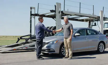Vehicle owner beside their delivered car in Olathe, Kansas, United States