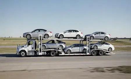 Multi-level car carrier on the highway to Ottawa, Kansas, United States