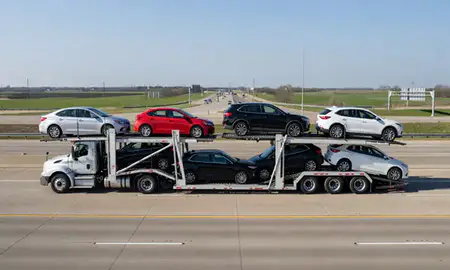 Multi-level car carrier on the highway to Overland Park, Kansas, United States