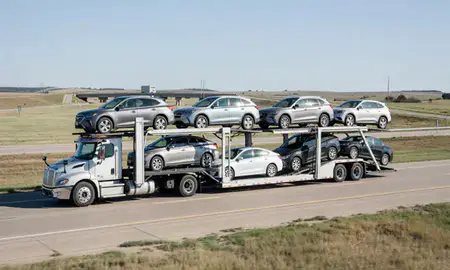 Multi-level car carrier on the highway to Pittsburg, Kansas, United States