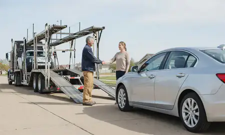 Vehicle owner beside their delivered car in Pittsburg, Kansas, United States