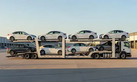 Car transporter parked in an industrial area of Pittsburg, Kansas, United States