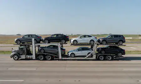 Multi-level car carrier on the highway to Salina, Kansas, United States