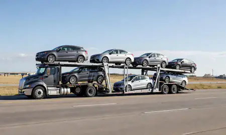 Multi-level car carrier on the highway to Topeka, Kansas, United States