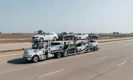 Multi-level car carrier on the highway to Wichita, Kansas, United States