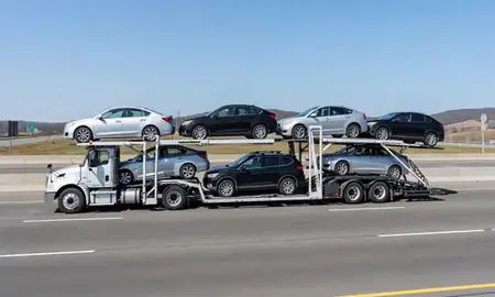 Multi-level car carrier on the highway to Kentucky, United States