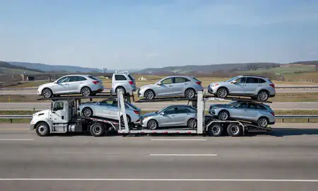 Multi-level car carrier on the highway to Ashland, Kentucky, United States