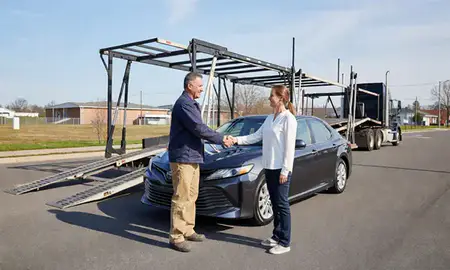 Vehicle owner beside their delivered car in Burlington, Kentucky, United States