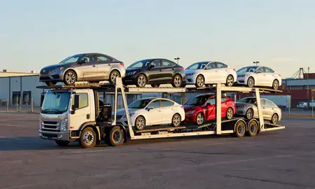 Car transporter loaded with vehicles in Covington, Kentucky, United States