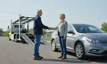 Vehicle owner beside their delivered car in Danville, Kentucky, United States