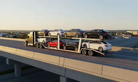 Car transporter with the Erlanger, Kentucky, United States skyline behind it