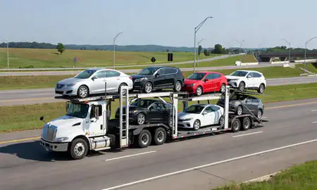 Multi-level car carrier on the highway to Frankfort, Kentucky, United States