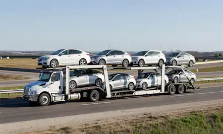 Multi-level car carrier on the highway to Henderson, Kentucky, United States
