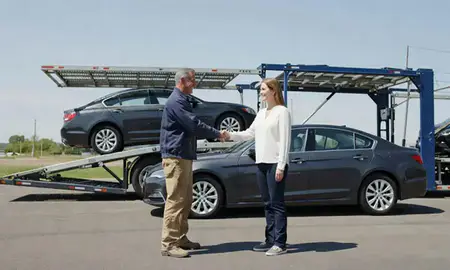 Vehicle owner beside their delivered car in Henderson, Kentucky, United States