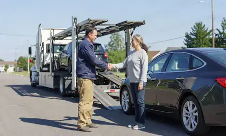 Vehicle owner beside their delivered car in Jeffersontown, Kentucky, United States