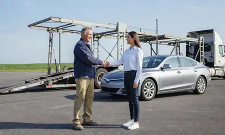 Vehicle owner beside their delivered car in Louisville, Kentucky, United States