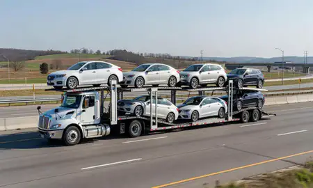 Multi-level car carrier on the highway to Madisonville, Kentucky, United States