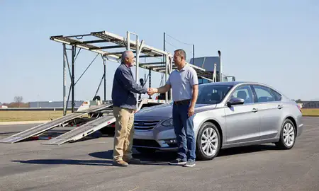 Vehicle owner beside their delivered car in Owensboro, Kentucky, United States