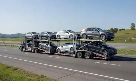 Multi-level car carrier on the highway to Shively, Kentucky, United States