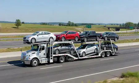 Multi-level car carrier on the highway to Winchester, Kentucky, United States