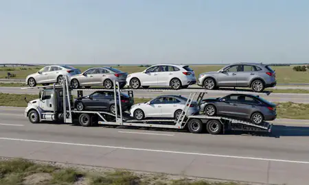 Multi-level car carrier on the highway to Louisiana, United States