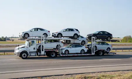 Multi-level car carrier on the highway to Alexandria, Louisiana, United States