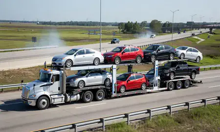 Multi-level car carrier on the highway to Baton Rouge, Louisiana, United States
