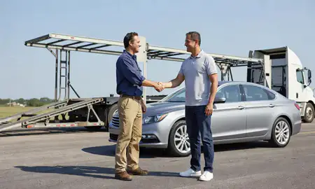 Vehicle owner beside their delivered car in Central, Louisiana, United States
