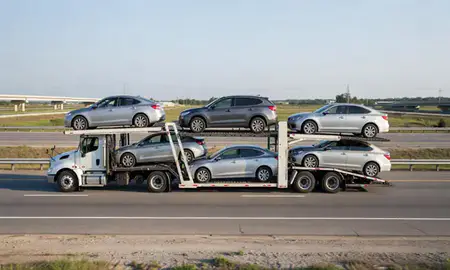 Multi-level car carrier on the highway to Chalmette, Louisiana, United States