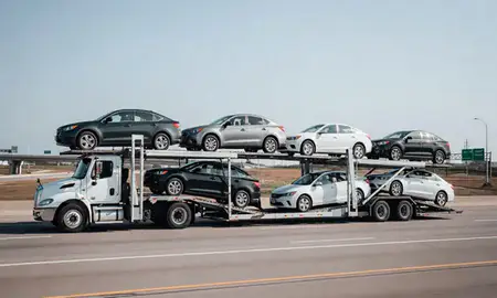 Multi-level car carrier on the highway to Gretna, Louisiana, United States