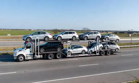 Multi-level car carrier on the highway to Hammond, Louisiana, United States