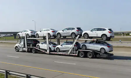 Multi-level car carrier on the highway to Harvey, Louisiana, United States
