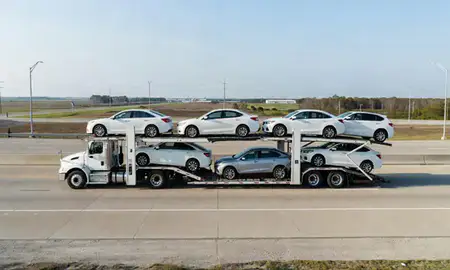 Multi-level car carrier on the highway to Houma, Louisiana, United States