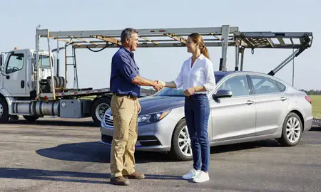 Vehicle owner beside their delivered car in Houma, Louisiana, United States
