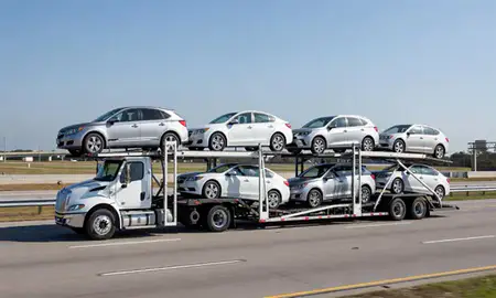 Multi-level car carrier on the highway to Lafayette, Louisiana, United States