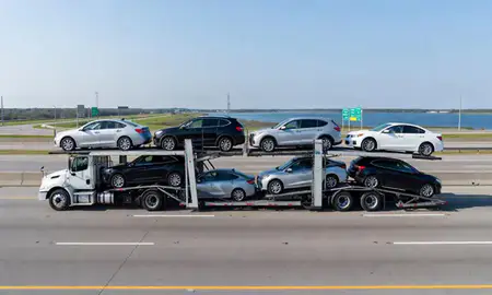 Multi-level car carrier on the highway to Lake Charles, Louisiana, United States