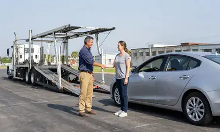 Vehicle owner beside their delivered car in Lake Charles, Louisiana, United States