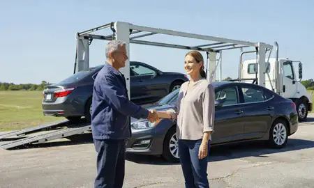 Vehicle owner beside their delivered car in Mandeville, Louisiana, United States