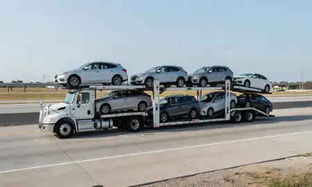Multi-level car carrier on the highway to Metairie, Louisiana, United States