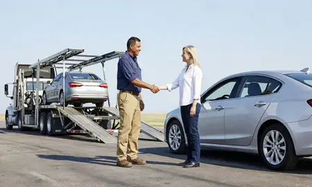 Vehicle owner beside their delivered car in Metairie, Louisiana, United States