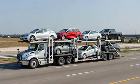 Multi-level car carrier on the highway to Natchitoches, Louisiana, United States