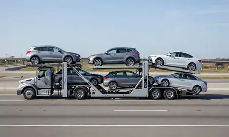 Multi-level car carrier on the highway to New Orleans, Louisiana, United States