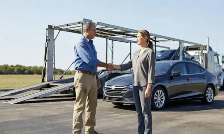 Vehicle owner beside their delivered car in Prairieville, Louisiana, United States