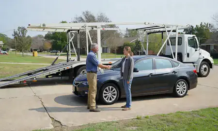 Vehicle owner beside their delivered car in Ruston, Louisiana, United States