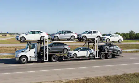 Multi-level car carrier on the highway to Shenandoah, Louisiana, United States