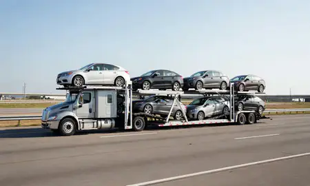 Multi-level car carrier on the highway to Shreveport, Louisiana, United States