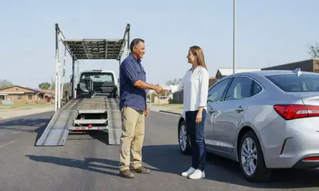 Vehicle owner beside their delivered car in Shreveport, Louisiana, United States
