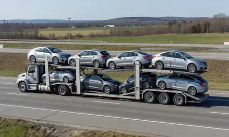 Multi-level car carrier on the highway to Maine, United States