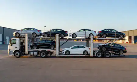 Car transporter parked in an industrial area of Auburn, Maine, United States