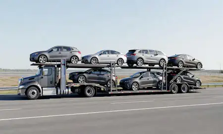 Multi-level car carrier on the highway to Bath, Maine, United States